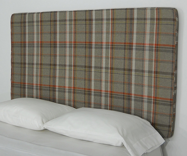 a picture of plaid fabric peel and stick upholstered wall mounted headboard